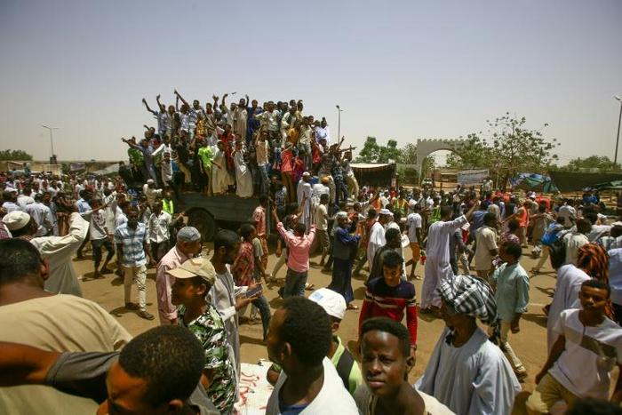 Sudanese protesters gather near the military headquarters in the capital Khartoum