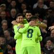 Luis Suarez (C) celebrates after his header was diverted home by United defender Luke Shaw
