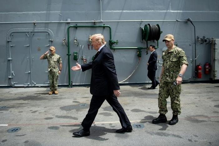 US media reported efforts were made to obscure the USS John S. McCain's name during President Donald Trump's visit to the Yokosuka Naval Base in Japan