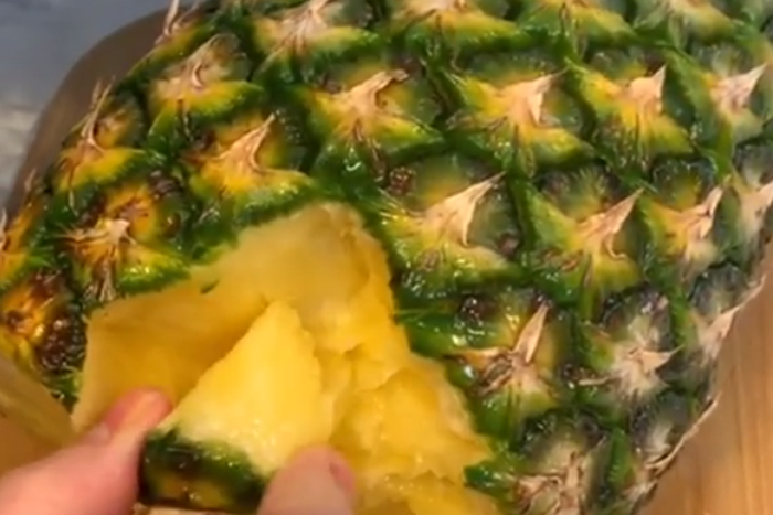 Eating pineapple