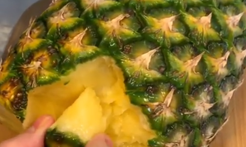 Eating pineapple
