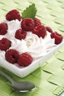 &quot;Rasberries on whipped cream in bowl, close-up&quot;