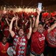 Thousands of boisterous, flag-draped Liverpool fans gave a rousing rendition of of "You'll Never Walk Alone", the club's legendary anthem.