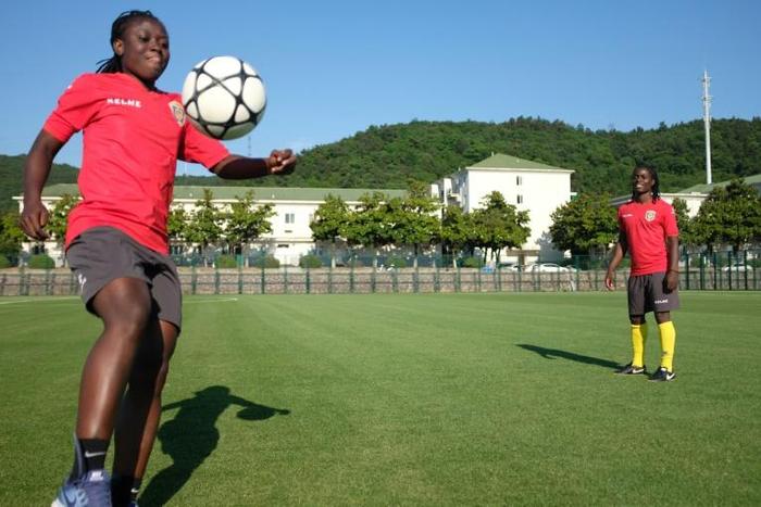 Ball control: Jiangsu Suning midfielder and Ghana captain Elizabeth Addo (left) trains with Malawi skipper Tabitha Chawinga in Nanjing