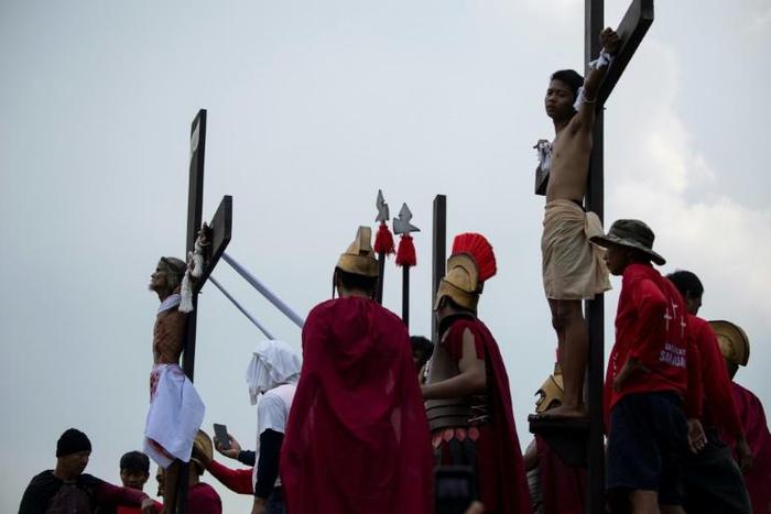Every Good Friday several men are nailed to a cross in a re-enactment of the crucifixtion of Jesus Christ to atone for sins or seek divine intercession