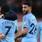 Pep Guardiola celebrates as goal hero Riyad Mahrez looks on