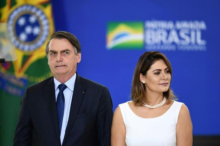 Brazilian President Jair Bolsonaro and first lady Michelle at a ceremony at the presidential Planalto Palace in Brasilia, on April 5, 2019: Bolsonaro completes his first 100 days of government on April 10.