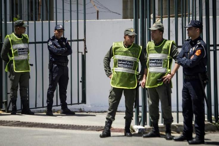 Moroccan security forces standing guard during Thursday's trial in Sale, near Rabat