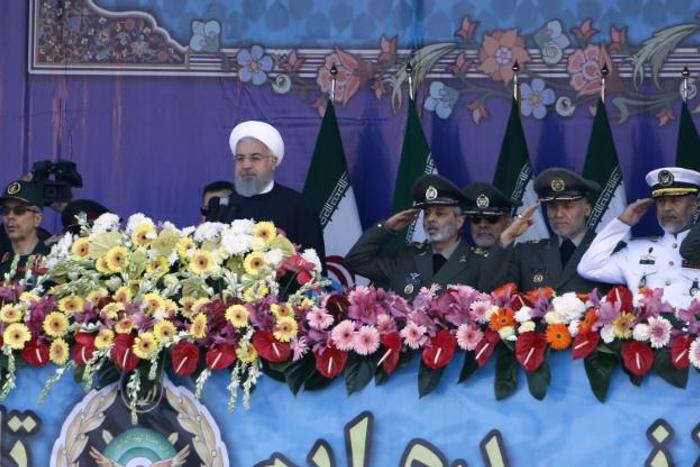 Iranian President Hassan Rouhani deliver his Army Day address in 2018 flanked by top generals