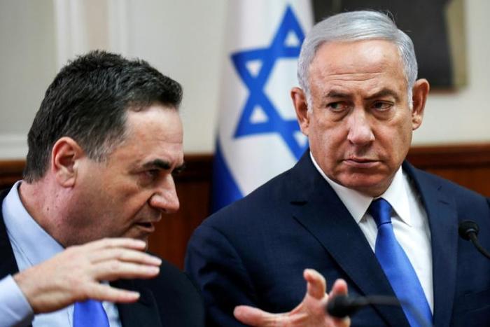 Israeli Prime Minister Benjamin Netanyahu (R) is handing the role of foreign minister to his right-wing rival from inside the Likud party Israel Katz (L)