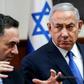 Israeli Prime Minister Benjamin Netanyahu (R) is handing the role of foreign minister to his right-wing rival from inside the Likud party Israel Katz (L)