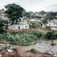 People abandon their homes at an informal settlement of BottleBrush, south of Durban, after torrential rains and flash floods destroyed their homes