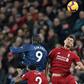 Liverpool's Dejan Lovren (right) in action against Manchester United