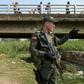 A Colombian policeman stands guard under the Simon Bolivar International Bridge, on the border between Tachira, Venezuela and Cucuta, Colombia, on February 7, 2019