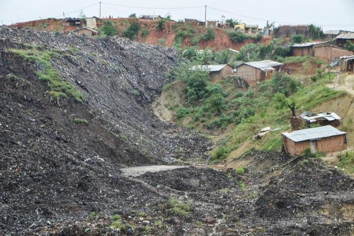 Four people died, and one is still missing, after a rubbish dump gave way and tore through the modest settlement of Chibuabuar in northern Mozambique