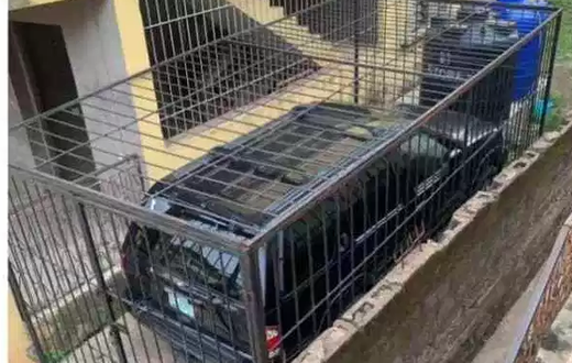 Man creates cage for his new car, locks it with padlock to save it from being stolen