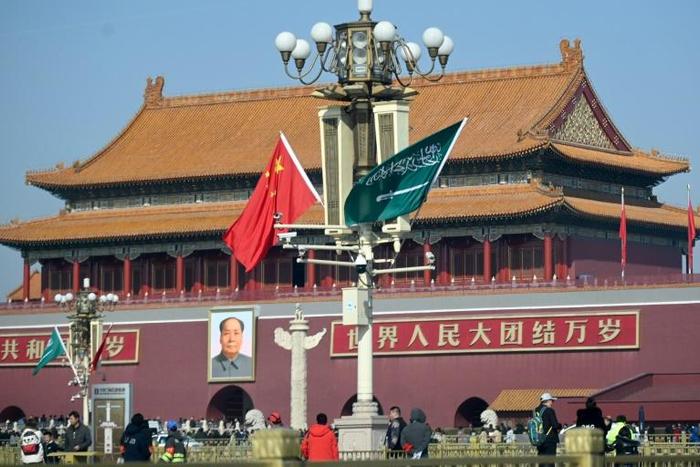 The national flags of Saudi Arabia and China are displayed on a lampost in Tiananmen square in Beijing ahead of Crown Prince Mohammed bin Salman's visit
