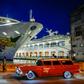 An old American car passes by the "Empress of the Seas", the last US-operated cruise ship to dock in Cuba following fresh US sanctions that ban stopovers on the island
