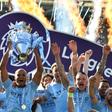 Manchester City captain Vincent Kompany holds up the Premier League trophy after their 4-1 victory against Brighton