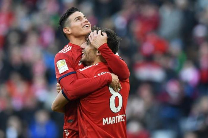 James Rodriguez and Javi Martinez celebrate the goal that took them level on points with Borussia Dortmund