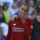 Jurgen Klopp talks with defender Virgil van Dijk after Liverpool's 2-0 win against Cardiff