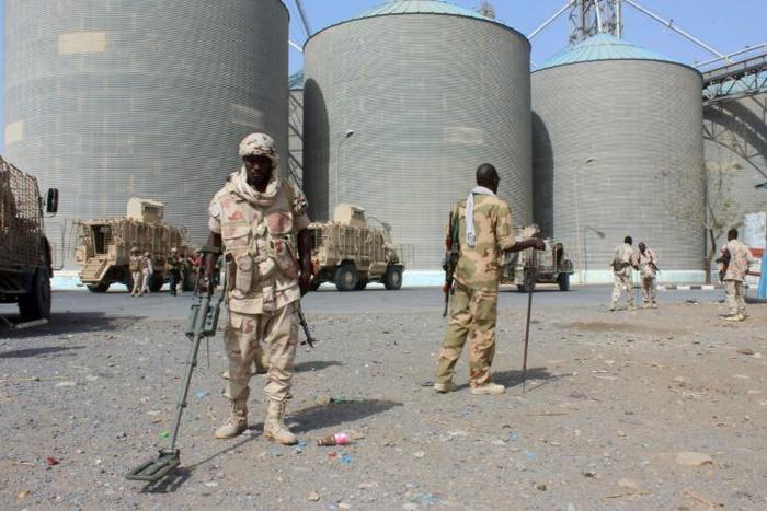 Sudanese troops serving in the Saudi-led military coalition in Yemen do mine-clearing at the Red Sea Mills silos in Hodeida, which has been off-limits to aid organisations for months