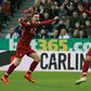 Liverpool's Egyptian midfielder Mohamed Salah (R) celebrates with Liverpool's Scottish defender Andrew Robertson (L) after scoring their second goal during the English Premier League football match between Newcastle United and Liverpool at St James' Pa...