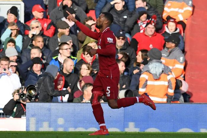 Pointing the way: Georginio Wijnaldum celebrated after Liverpool's second goal in the Premier League leaders' 3-0 win over Bournemouth at Anfield
