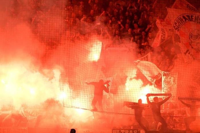 Stuttgart fans light flares during the relegation-promotion play off with Union Berlin