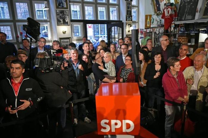 Exit polls show Germany's Social Democratic Party which was not only toppled from second place at European polls by the Greens, but also suffered a humiliating loss at state elections in its stronghold Bremen.