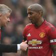 Manchester United caretaker manager Ole Gunnar Solskjaer (left) talks with Ashley Young