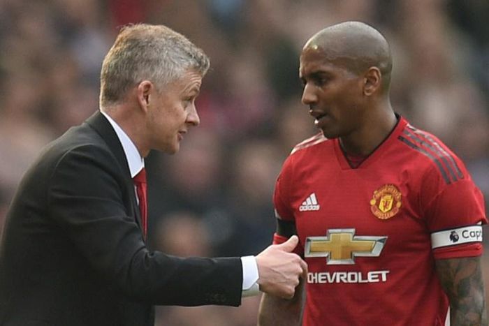 Manchester United caretaker manager Ole Gunnar Solskjaer (left) talks with Ashley Young