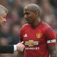 Manchester United caretaker manager Ole Gunnar Solskjaer (left) talks with Ashley Young