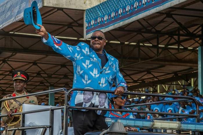 Mutharika salutes the crowd at the launch of his party manifesto in April