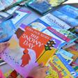 A student at Telfair Elementary School in Los Angeles county makes her choice for a free book during a morning at Operation School Bell -- a quarter of the school's 720 children are in need of food, shelter or clothing