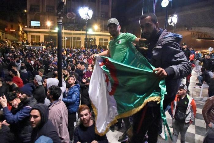 Algerians demonstrate in the capital Algiers early on March 4, 2019 against ailing President Abdelaziz Bouteflika's bid for a fifth term after he promised to quit early if re-elected