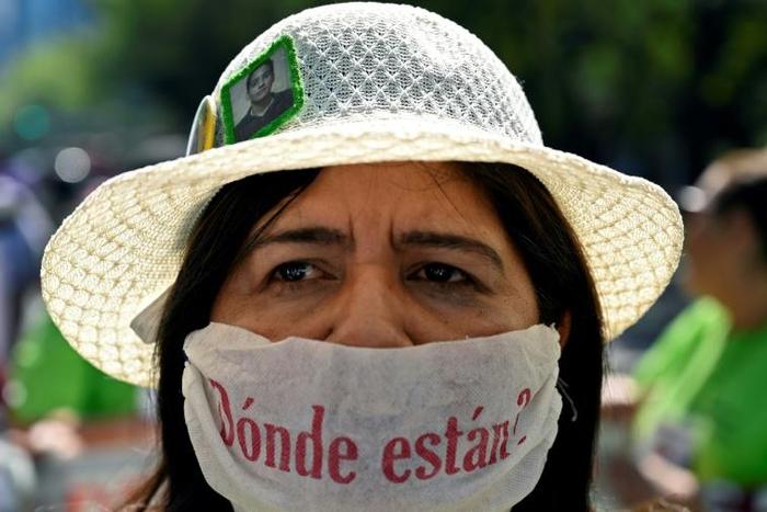 A woman with a surgical mask reading "Where are they?" takes part in a march of activists and relatives of missing people to demand answers on the whereabouts of their loved ones, as part of the commemoration of Mothers' Day in Mexico City