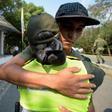 A Colombian police officer hugs a deserting Venezuelan soldier who crossed the border on February 25, 2019