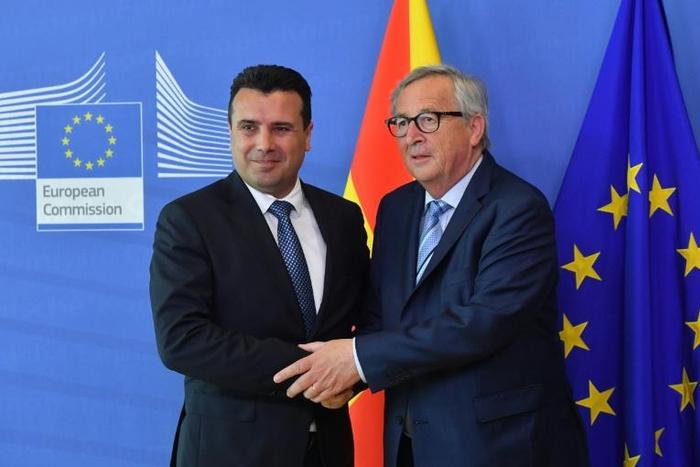 North Macedonia's Prime Minister Zoran Zaev (L) is welcomed by European Commission President Jean-Claude Juncker at the European Commission in Brussels on June 4, 2019