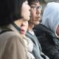 Some people waited anxiously on the banks of the Danube river for news of those still missing from the sightseeing boat, most of them South Korean tourists