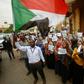 Employees demonstrate outside Bank of Khartoum on May 28, 2019 as they participate in a two-day national strike to step up pressure on the ruling military council