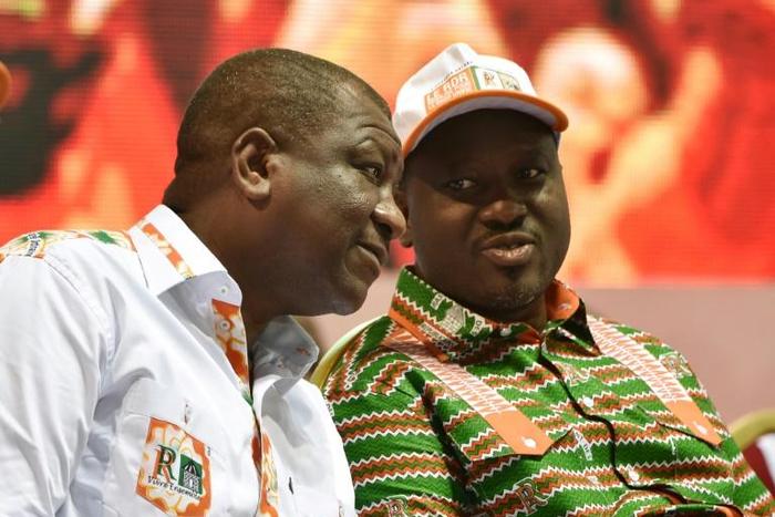 Former Ivorian rebel chief Guillaume Soro, seen here on the right, has said he is stepping down as parliamentary leader