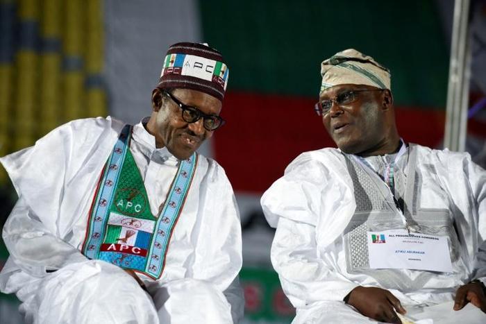Former military ruler and incumbent Muhammadu Buhari (L) faces off against main rival and former vice president Atiku Abubakar in next week's election