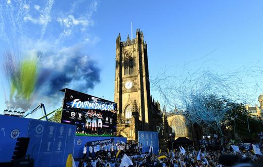 Manchester City celebrated their domestic treble with an open-top bus parade on Monday, drawing an estimated 100,000 fans to the streets of the city centre