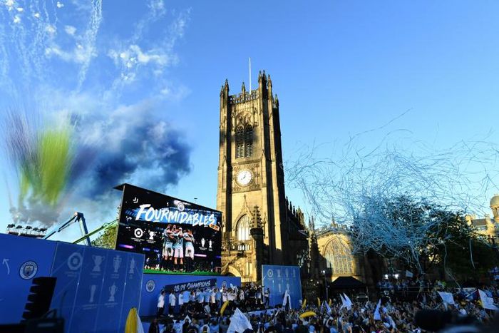 Manchester City celebrated their domestic treble with an open-top bus parade on Monday, drawing an estimated 100,000 fans to the streets of the city centre