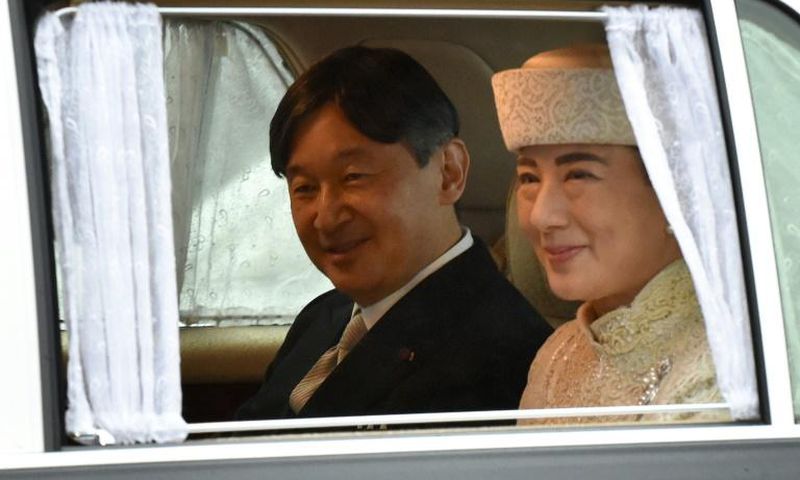 A vehicle carrying Naruhito and his wife Masako leaves the Imperial Palace in Tokyo. Naruhito will formally take over as Japan's emperor Wednesday following the abdication of his father Akihito