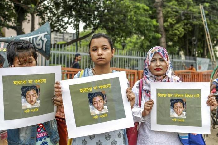 Bangladeshi women hold posters of murdered schoolgirl Nusrat Jahan Rafi at a protest in Dhaka. Authorities have ordered state-funded Islamic seminaries to appoint female mentors to prevent violence against women and children