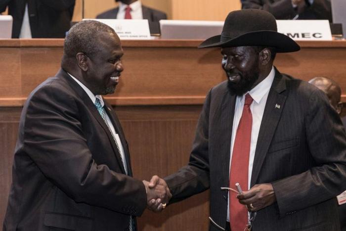 Handshake: South Sudan's president, Salva Kiir, right, and his former deputy turned rebel leader, Riek Machar, seal the peace deal in Addis Ababa last September