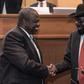Handshake: South Sudan's president, Salva Kiir, right, and his former deputy turned rebel leader, Riek Machar, seal the peace deal in Addis Ababa last September