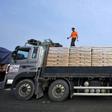 A South Korean driver checks sacks of flour bound for North Korea before crossing the inter-Korean border in Paju, north of Seoul